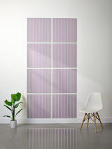 Eight lavender tiles with white parallel line engravings arranged in a 2x4 grid on a wall.
