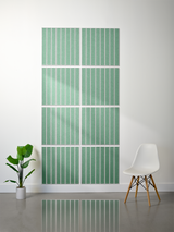 Eight green rectangular tiles with white parallel engraved lines arranged in a 2x4 grid pattern on a wall.