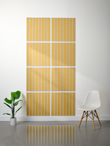 Eight square tiles with parallel vertical line engravings in gold and white arranged in a 2x4 grid on a wall.