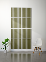 Eight olive-green tiles with white parallel line engraving arranged in a 2x4 grid on a wall.