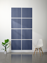 Eight dark blue tiles with white parallel vertical engraved lines arranged in a 2x4 grid on a white wall.