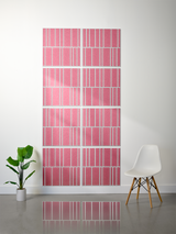 Eight pink tiles with white engraved offset pattern arranged in a 2x4 grid on wall.