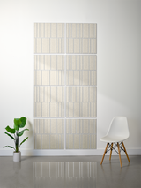 Eight beige rectangular tiles with vertical engraved lines arranged in offset pattern on wall.