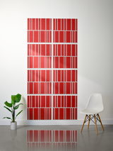 Eight red tiles with white engraved lines arranged in offset pattern on white wall.