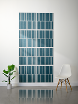 Eight teal and white offset tiles with engraved linear patterns arranged in a vertical installation.