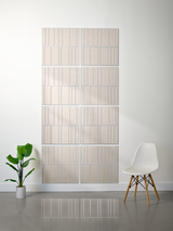 Eight beige tiles with vertical engraved lines arranged in offset pattern on wall.