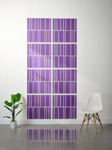 Eight purple tiles with white engraved vertical lines in offset pattern arrangement on wall.