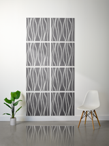 Eight gray tiles with white wavy vertical line engravings arranged in a 2x4 grid on a wall.