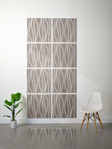 Eight tan tiles with white engraved wavy vertical lines arranged in a 2x4 grid on white wall.