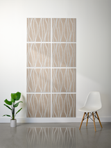 Eight beige tiles with white wavy line engravings arranged in a 2x4 grid on white wall.