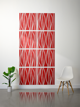 Eight red tiles with white wavy engraved lines arranged in a 2x4 grid on a wall.