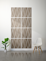 Eight taupe tiles with white wavy line engraving arranged in a 2x4 grid on a wall.