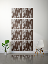 Brown and white engraved tiles with wavy river pattern arranged in a 2x4 grid on wall.