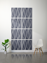 Eight dark blue tiles with white wavy vertical line engraving arranged in a 2x4 grid on a wall.