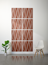 Eight terracotta tiles with white wavy engraved line patterns arranged in a 2x4 grid on a wall.