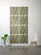 Eight olive green tiles with white wavy line engraved pattern arranged in a 2x4 grid on wall.