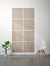 Eight tan tiles with white engraved geometric and curved line patterns arranged in a 2x4 grid on a wall.