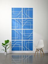 Eight blue tiles with white engraved lines forming an abstract geometric subway-style pattern when arranged together.