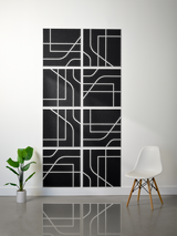 Eight black square tiles with white engraved lines forming geometric subway-style patterns arranged in a 2x4 grid.