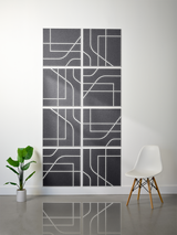 Eight dark gray tiles with white engraved geometric and curved line patterns arranged in a 2x4 grid.