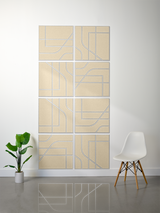 Eight cream-colored tiles with blue engraved lines in geometric subway pattern, arranged in 4x2 grid on wall.