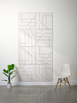 Eight light gray subway tiles with engraved geometric and curved line patterns arranged in a 2x4 grid on a wall.