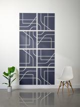 Eight dark blue tiles with white engraved geometric lines and curved patterns arranged in a 2x4 grid on a wall.