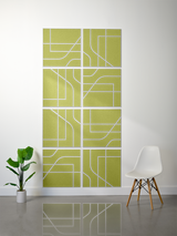 Eight chartreuse tiles with white engraved subway map lines arranged in a 2x4 grid pattern on wall.