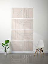 Eight beige tiles with engraved geometric lines and subway-style patterns arranged in a 2x4 grid on a wall.