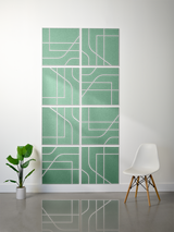 Eight green tiles with white engraved geometric lines and curved patterns arranged in a 2x4 grid on a wall.