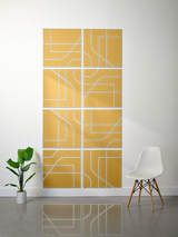 Eight gold tiles with white engraved linear patterns and curved lines arranged in a 2x4 grid on wall.