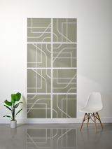 Eight sage green square tiles with white engraved linear and curved geometric patterns arranged in a 2x4 grid.