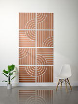 Eight terracotta tiles with white engraved vertical lines and curved arc patterns arranged in a 4x2 grid.