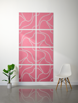 Eight pink tiles with white engraved topographic line patterns arranged in a 2x4 grid on a wall.