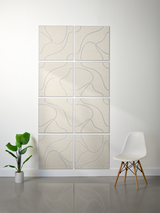 Eight cream-colored square tiles with blue topographic line engravings arranged in a 2x4 grid on a wall.