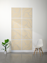 Eight tan tiles with blue topographic contour line engravings arranged in a 2x4 grid wall display.