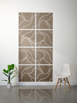 Eight tan tiles with white engraved curved line patterns arranged in a 2x4 grid on a wall.