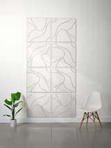 Eight square tiles with engraved topographic contour lines in cream and gray, arranged in a 2x4 grid on a wall.