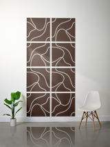 Brown square tiles with white engraved topographic line patterns arranged in an 8-tile grid.