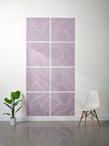 Eight lavender tiles with white topographic line engravings arranged in a 2x4 grid on a wall.