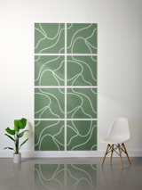 Eight green tiles with white engraved topographic line patterns arranged in a grid display.