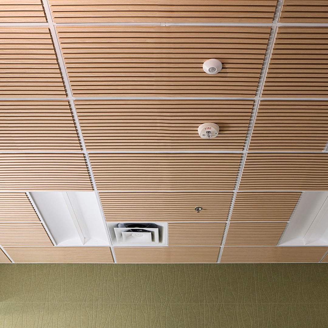 Wooden ceiling paneling with fire alarm and light fixture