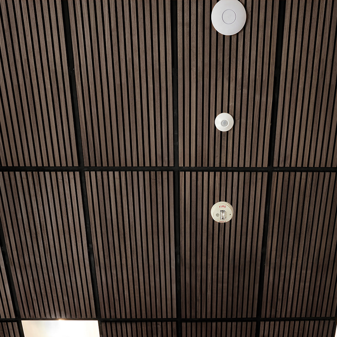 Close-up of a brown textured surface with circular metallic fixtures.
