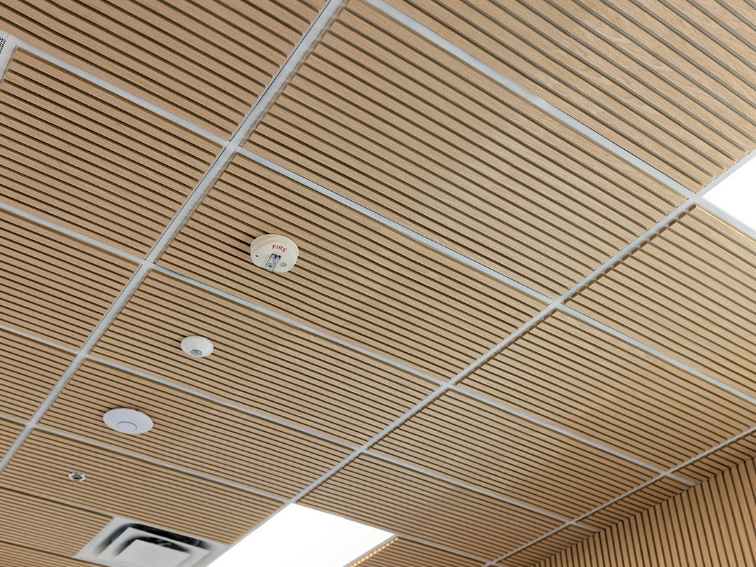 Ceiling with wooden paneling and light fixtures