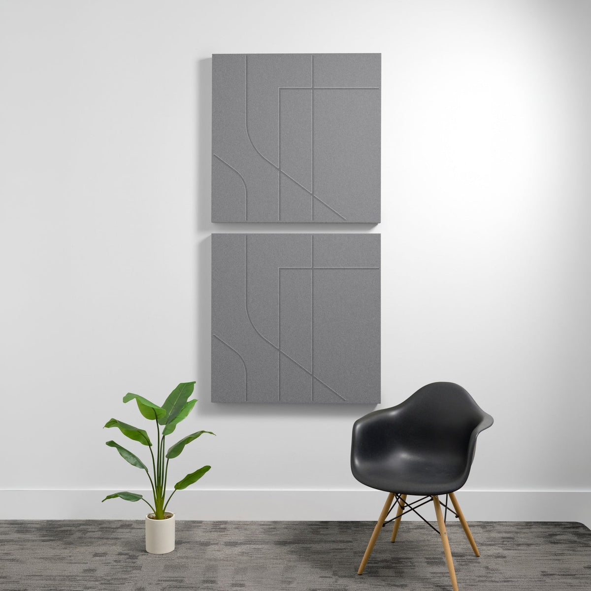 Two gray acoustic wall panels with engraved subway-style linear patterns, mounted vertically on white wall.