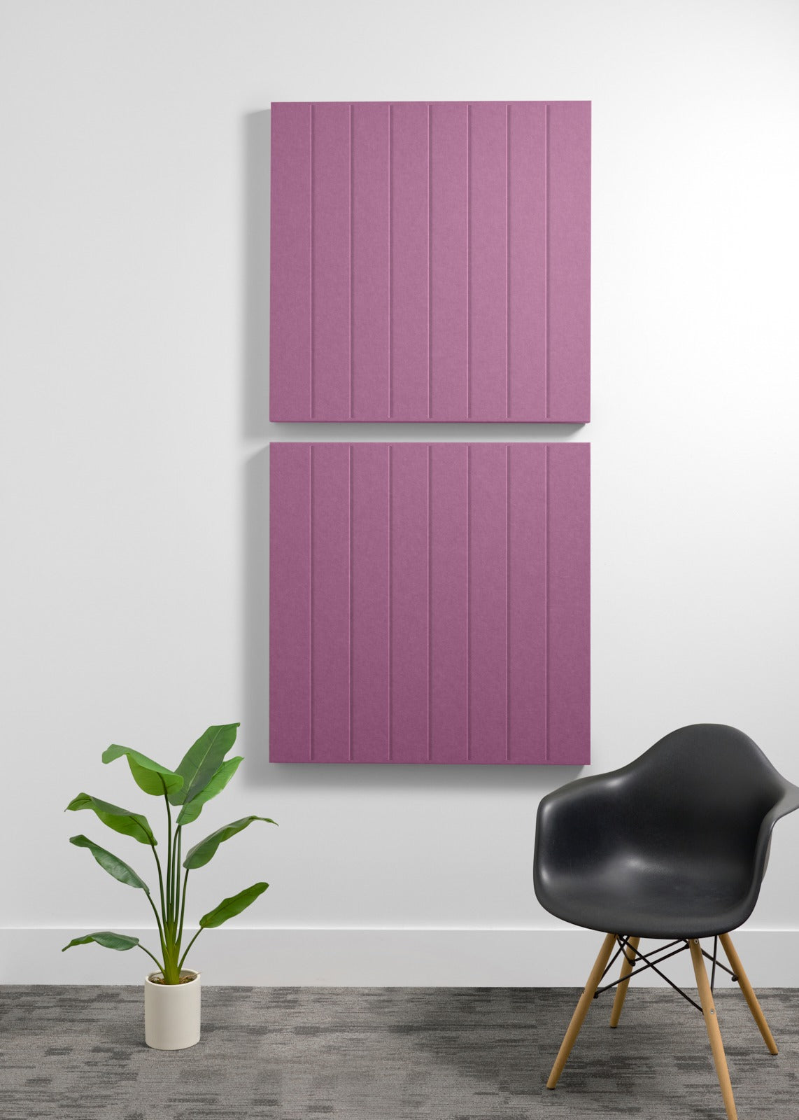 Two stacked mauve-pink acoustic panels with vertical ribbed texture mounted on white wall.