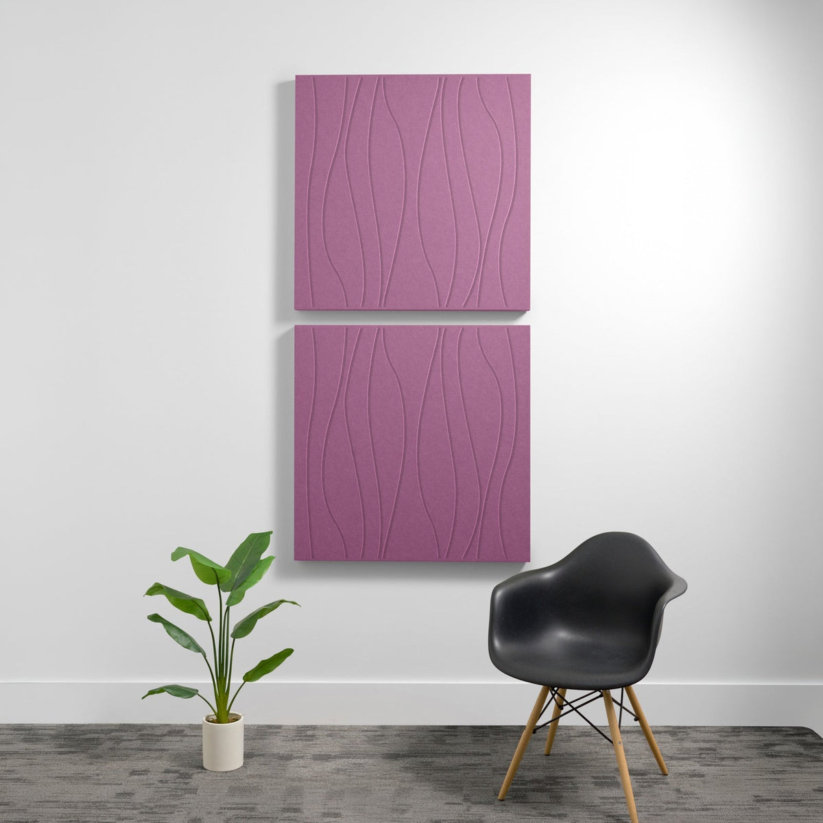 Two mauve acoustic wall panels with wavy engraved surface pattern mounted vertically on white wall.