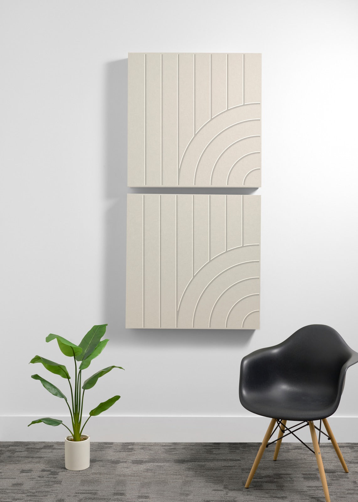 Two stacked cream-colored acoustic wall panels with engraved vertical lines and curved arc patterns.