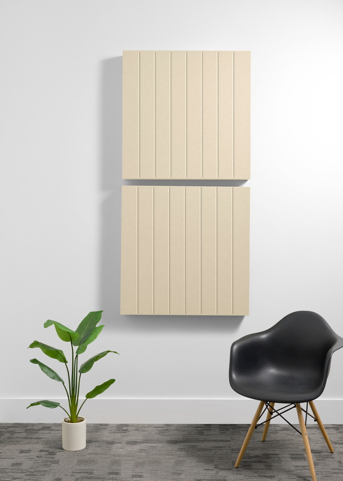 Two stacked cream-colored acoustic wall panels with parallel vertical engraved lines and gray divider strip.