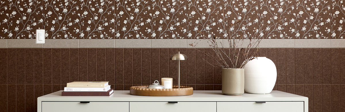 Printed acoustic felt tiles in brown over the top of brown wainscoting 